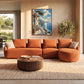 Azure Terrace artwork displayed above an orange sofa beside tall windows.