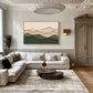 Quiet Contours artwork displayed above a cream sofa beneath a sculptural ceiling light.