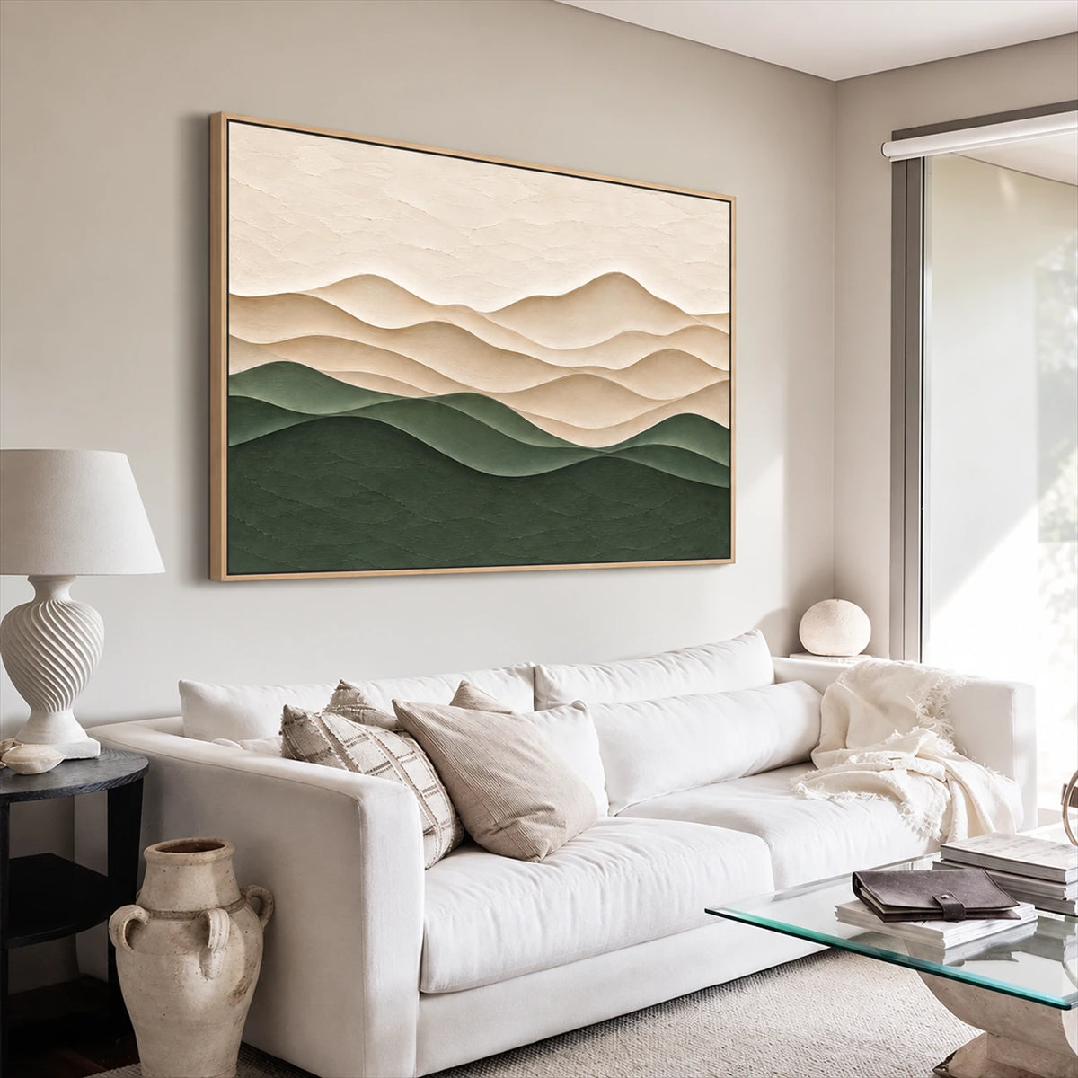 Quiet Contours artwork displayed above a pale sofa beside a window.