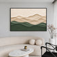 Quiet Contours artwork displayed above a curved sofa beside a black chair.