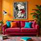 Heartfelt Companion artwork displayed above a bright pink sofa on an orange wall.