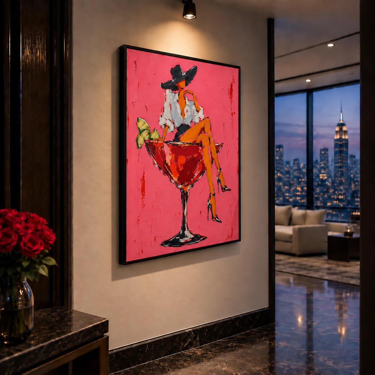 Cocktail Muse artwork displayed on a wall beside city windows.