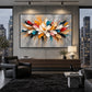 Chromatic Petals artwork displayed above a dark sofa beside city windows.