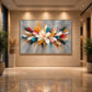 Chromatic Petals artwork displayed on a large illuminated lobby wall.