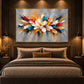 Chromatic Petals artwork displayed above a bed against dark wall paneling.