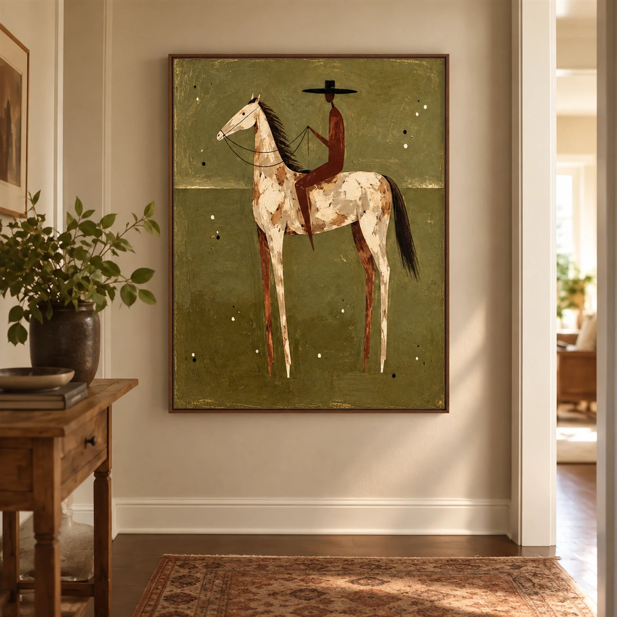 Russet Rider artwork displayed above a cushioned bench beside tall windows.