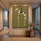 Piebald Poise artwork displayed above a console beside a stair railing.