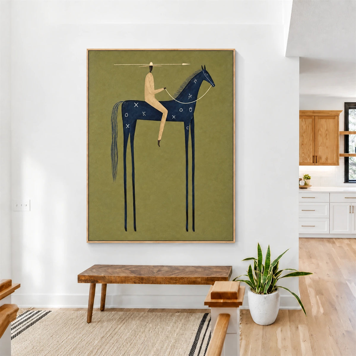 Indigo Standard artwork displayed above a wooden bench in a bright interior.