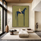 Indigo Standard artwork displayed above low lounge seating beside tall windows.