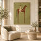 Chestnut Standard artwork displayed above a cream sofa beside sunlit curtains.