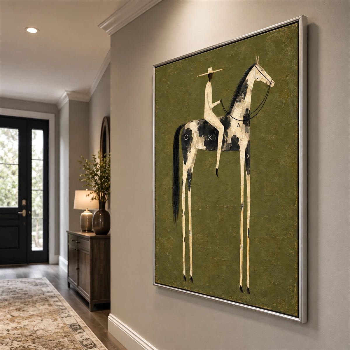 Painted Sentinel artwork displayed above a low console beside a bright entryway.