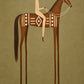Terracotta Standard full artwork. A rider in cream carries a long horizontal spear above a terracotta horse with bold ivory geometric decoration.