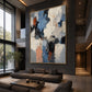 Slate Fragments artwork displayed above a sofa in a double-height living room.