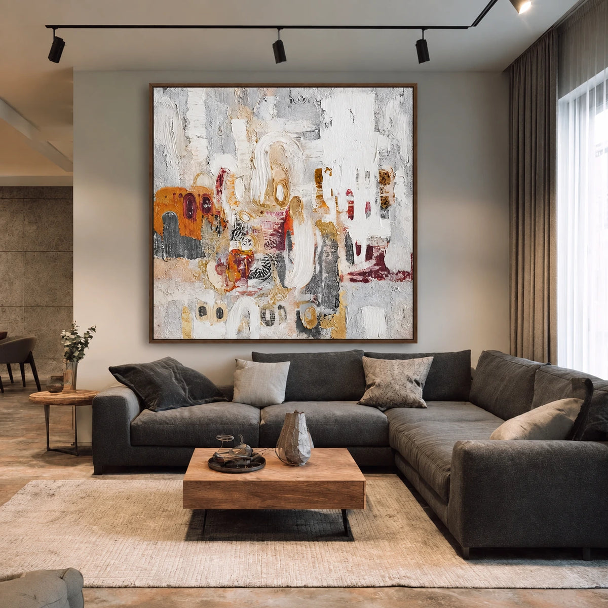 Ochre Palimpsest artwork displayed above a dark sectional sofa.