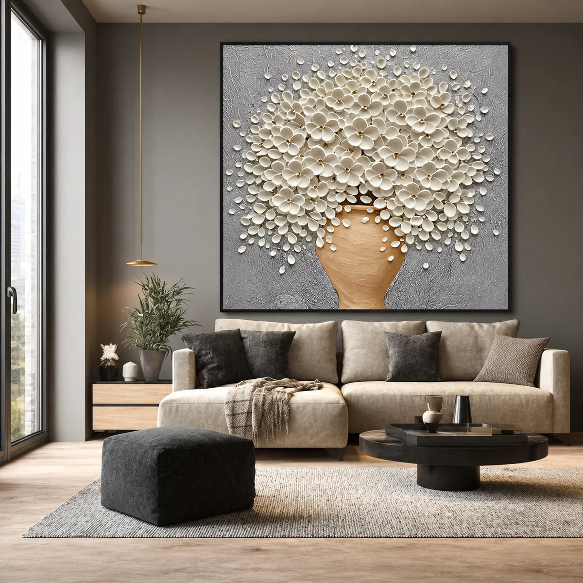 Porcelain Bouquet artwork displayed above a sofa beside tall windows.