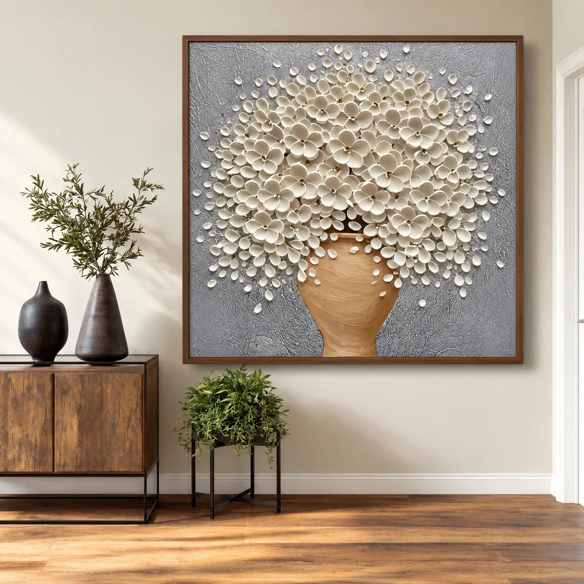 Porcelain Bouquet artwork displayed above a wooden console and indoor plants.