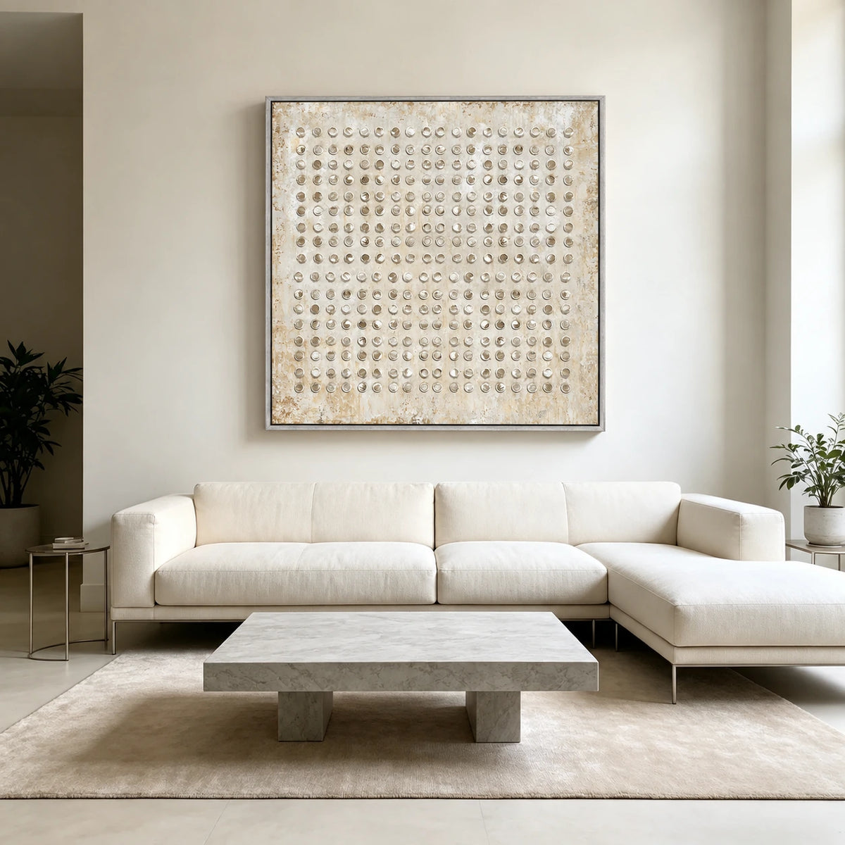 Ivory Rings artwork displayed above a white sectional sofa.