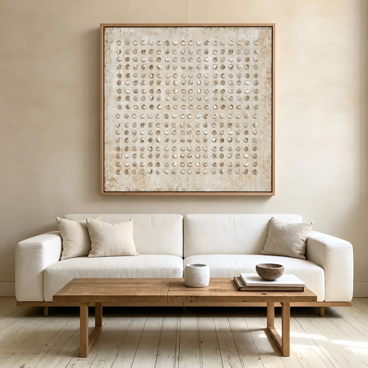 Ivory Rings artwork displayed above a white sofa and wooden coffee table.