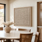 Linen Intervals artwork displayed beside a dining table and wooden chairs.