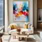 Chromatic Flourish artwork displayed above a white sofa with mustard cushions.
