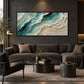 Jade Shoreline artwork displayed above a charcoal sofa in a dark lounge.