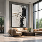 Ivory Divide artwork displayed above cream seating in a double-height lounge.