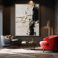 Ivory Divide artwork displayed above curved seating against a dark wall.