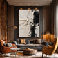Ivory Divide artwork displayed above a sofa in a warm wood-paneled lounge.
