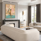 Poolside Pages artwork displayed above a fireplace in a bright living room.