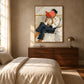 Vermilion Pages artwork displayed above a wooden dresser beside a bed.