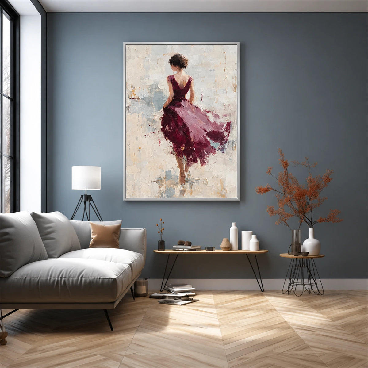 Plum Pirouette artwork displayed above a gray sofa against a blue wall.