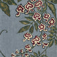 Trailing Orchids full artwork. A trailing branch of patterned blossoms curves across a muted blue ground, framed by deep green leaves.