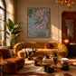 Trailing Orchids artwork displayed above a mustard sofa in a warm lounge.