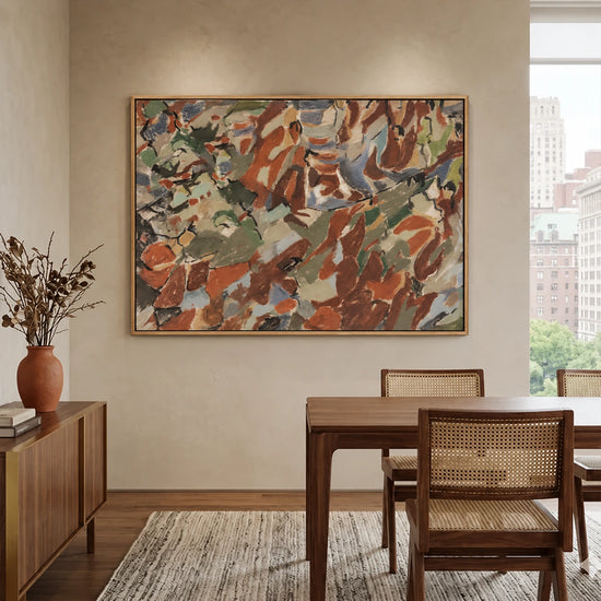 Earthen Mosaic artwork displayed above a wooden dining table.