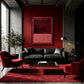 Burgundy Fields artwork displayed above a black sofa against a red wall.