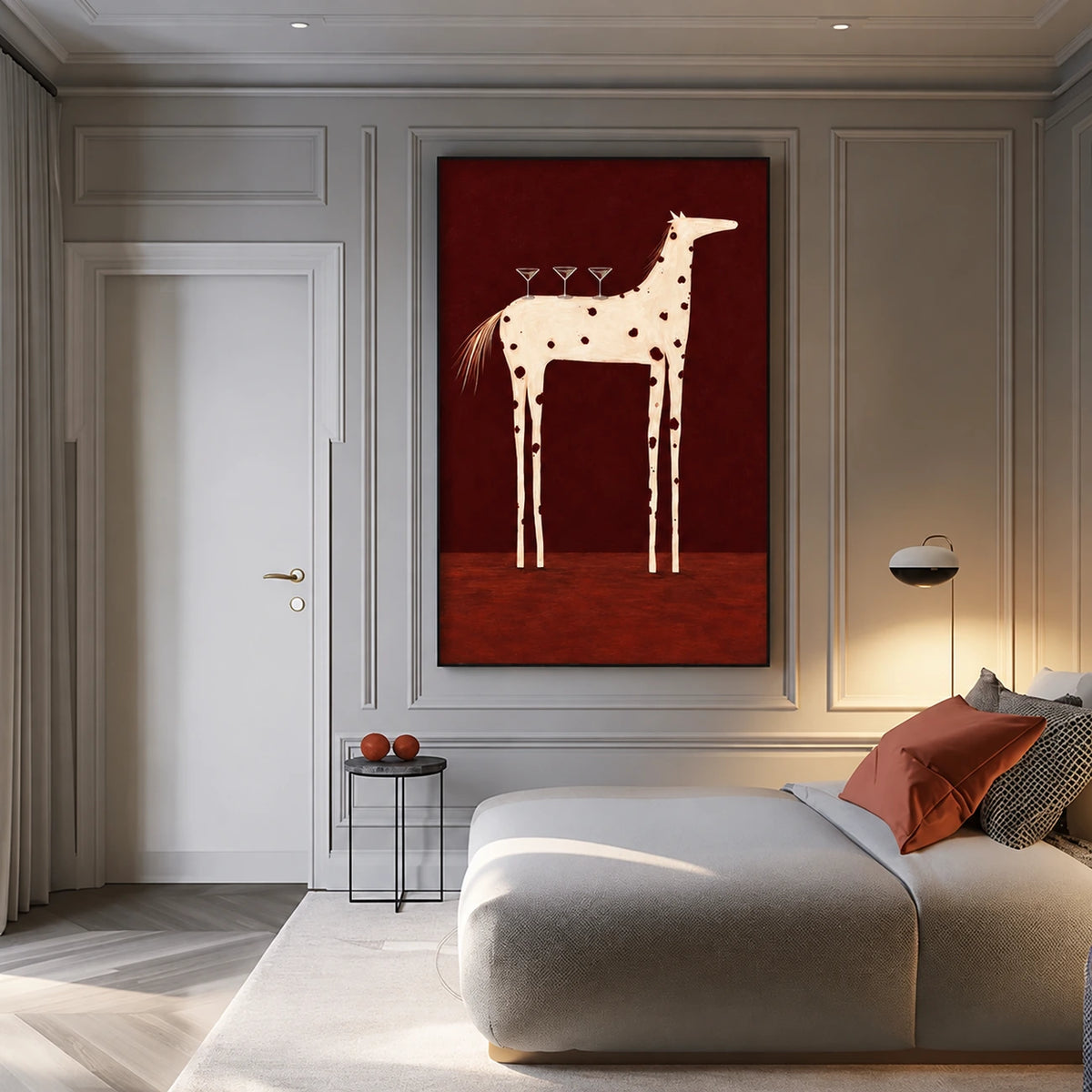 Cocktail Steed artwork displayed beside a white sectional against a paneled wall.