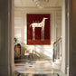 Cocktail Steed artwork displayed beside a staircase in a bright entryway.