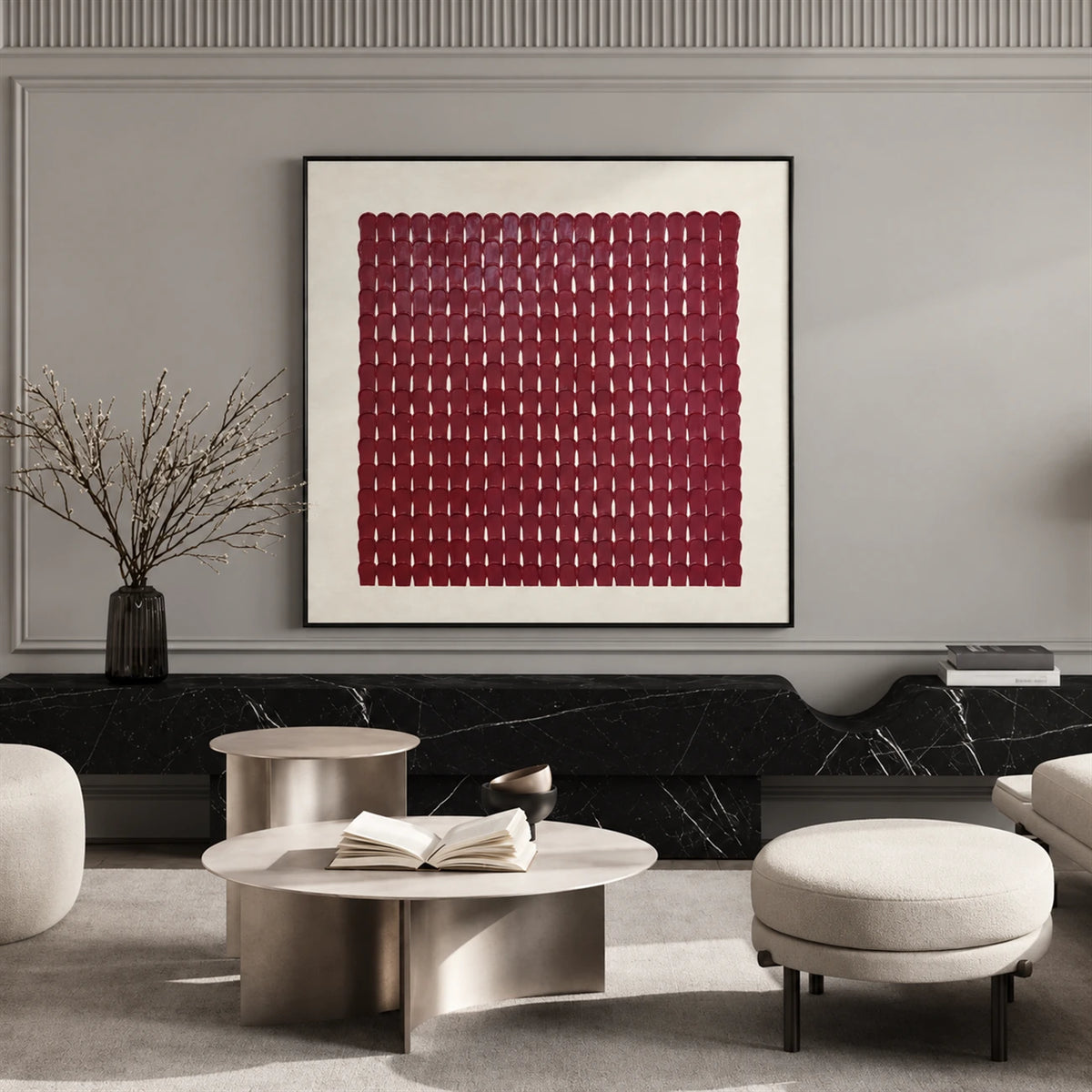 Burgundy Rhythm artwork displayed above seating and low tables against a paneled wall.