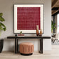 Burgundy Rhythm artwork displayed above a slim console and ribbed ottoman.