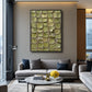 Olive Tessera artwork displayed above a gray sofa near an open doorway.