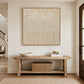Linen Cadence artwork displayed above a wooden entryway bench.