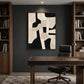 Ivory Interlock artwork displayed above a desk between bookshelves.