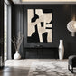 Ivory Interlock artwork displayed above a console against a charcoal wall.
