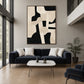 Ivory Interlock artwork displayed above a sofa in a double-height lounge.