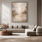 Gilded Haze artwork displayed above a pale sectional sofa.