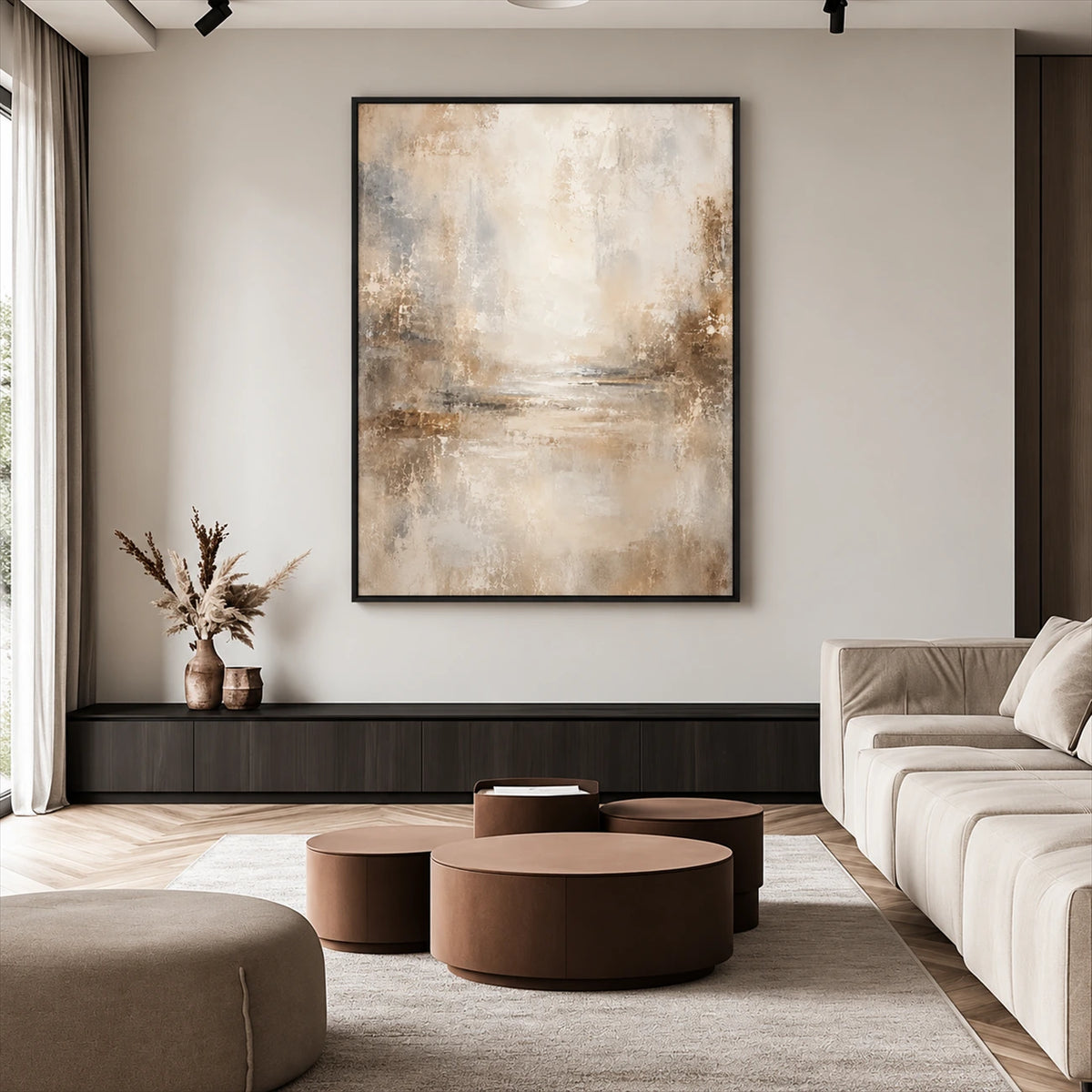 Gilded Haze artwork displayed above a cream sofa and round coffee tables.
