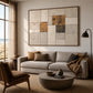 Ochre Masonry artwork displayed above a neutral sofa beside a window.