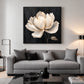 Ivory Magnolia artwork displayed above a gray sofa in a bright lounge.