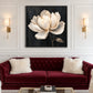 Ivory Magnolia artwork displayed above a burgundy sofa.