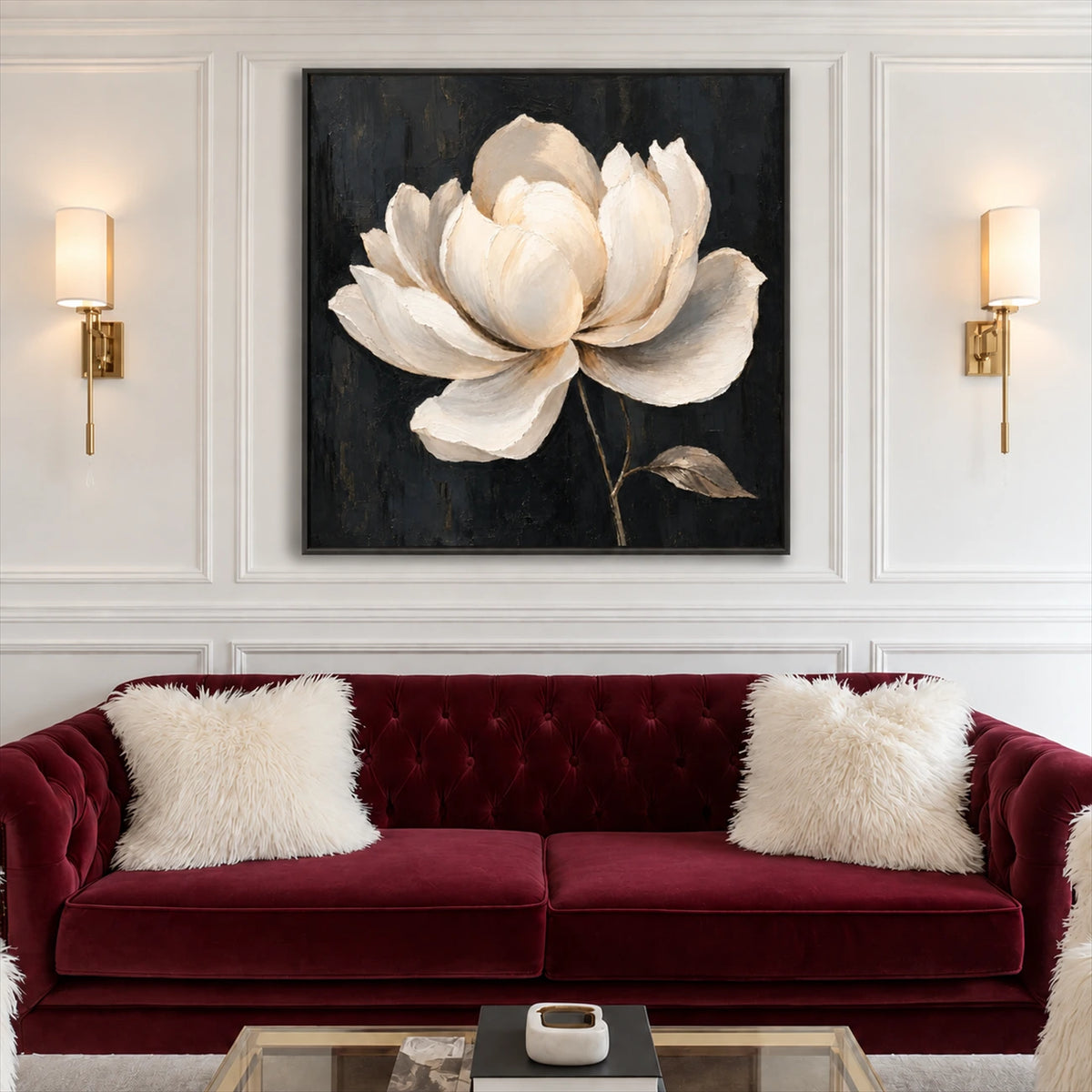 Ivory Magnolia artwork displayed above a burgundy sofa.